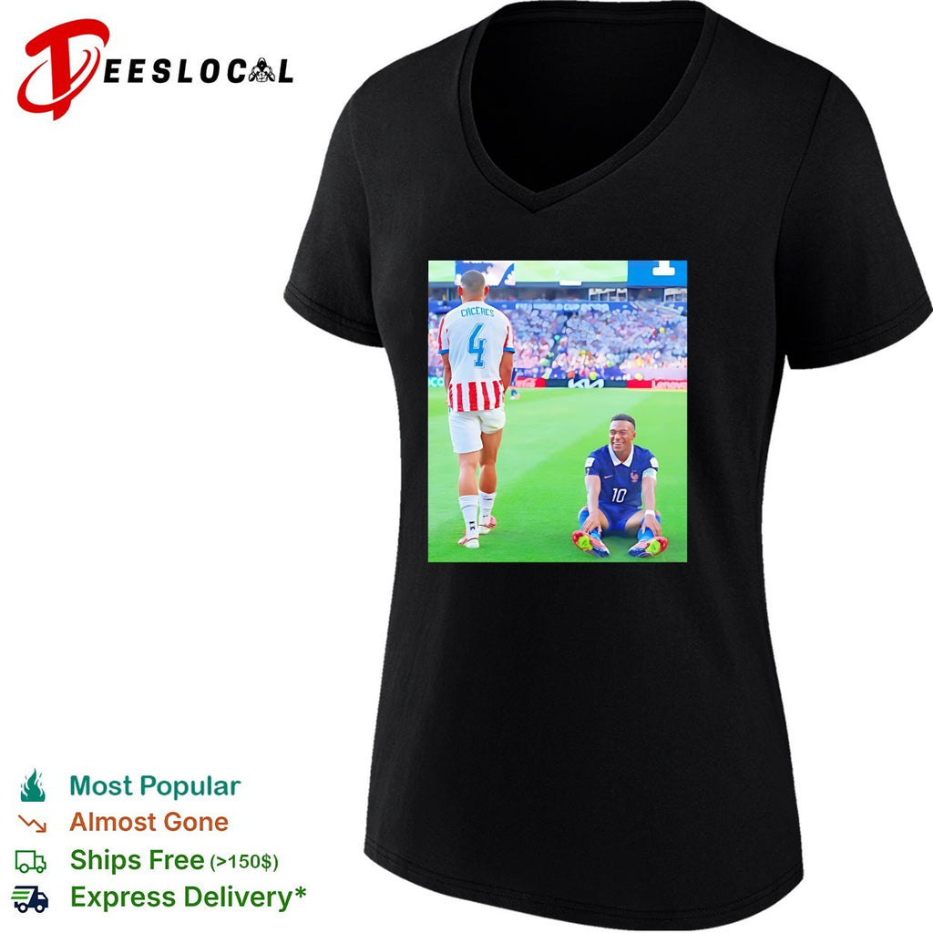 Mbappe France number 10 laughing on pitch Caceres number 4 World Cup shirt