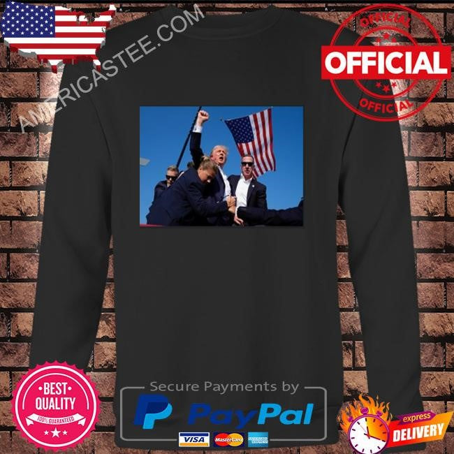 Trump being rushed off while pumping his fist after being shot in the ear at his rally shirt