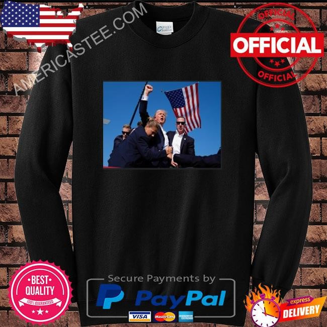 Trump being rushed off while pumping his fist after being shot in the ear at his rally shirt