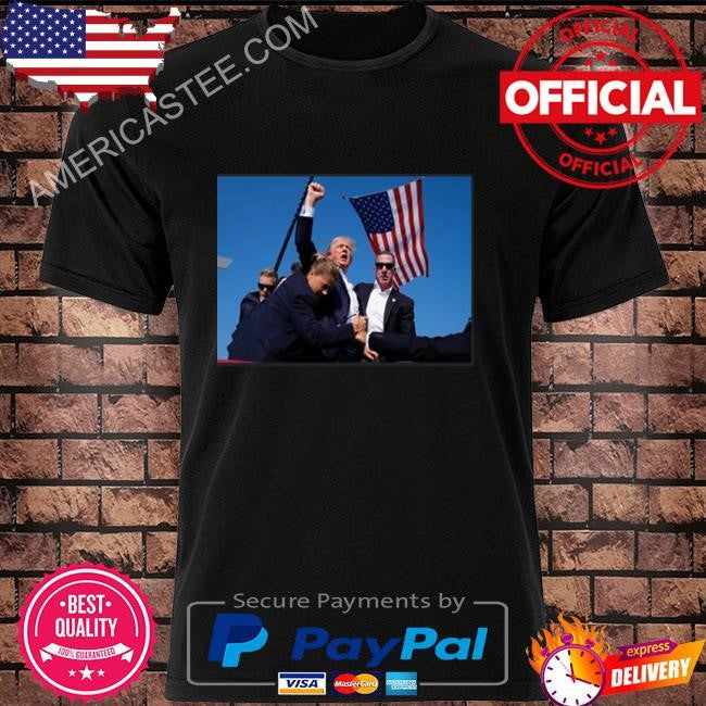 Trump being rushed off while pumping his fist after being shot in the ear at his rally shirt