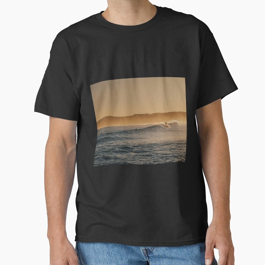 Ocean waves under orange sky surfer by Darius Bocos T-Shirts, Hoodie, Sweatshirt | BlankRebels.com (Image 1)