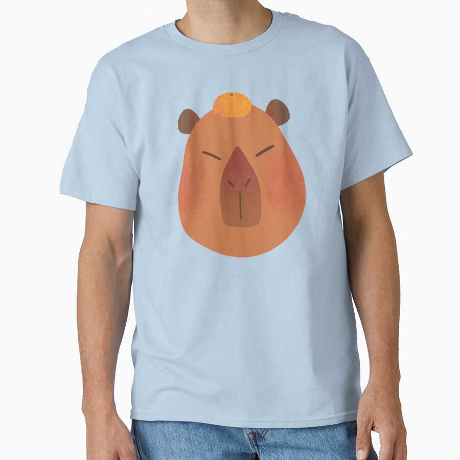 Cute Fluffy Brown Capybara with a Mandarin on Its Head by Yulia Saraswati T-Shirts, Hoodie, Sweatshirt (Image 1)