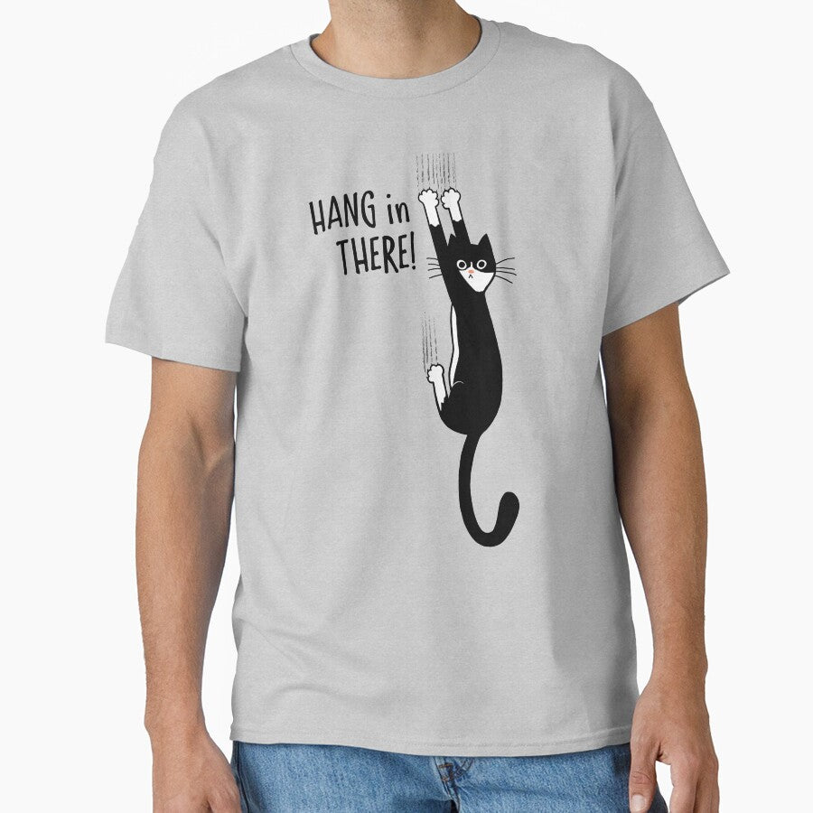 Tuxedo Cat Hanging On Hang In There! Funny Cat Hanging On With Claws by Jenn Inashvili T-Shirts, Hoodie, Sweatshirt (Image 1)