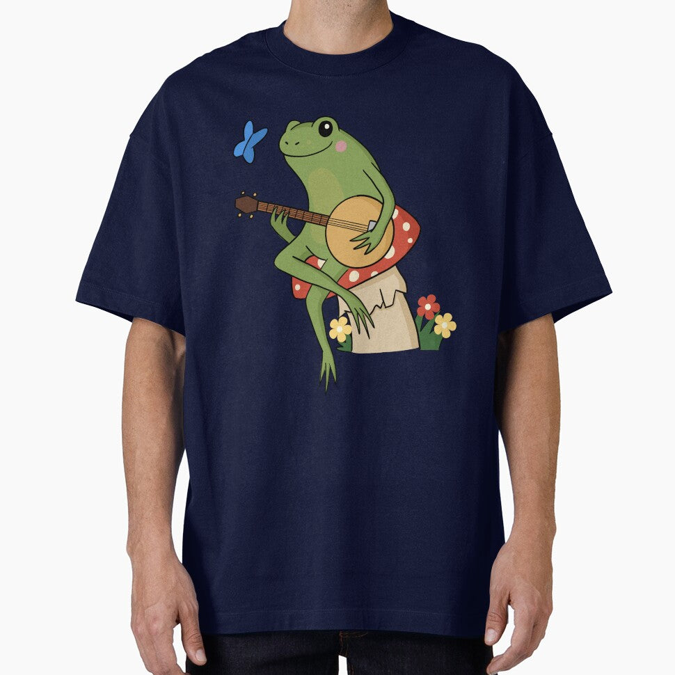 Cottagecore aesthetic cute frog playing a banjo sitting on a mushroom by HopItStudio T-Shirts, Hoodie, Sweatshirt (Image 1)
