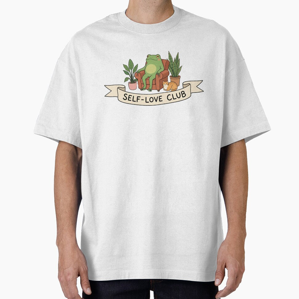 Self-Love Club - Cozy Frog Reading by Nastre T-Shirts, Hoodie, Sweatshirt | BlankRebels.com (Image 1)